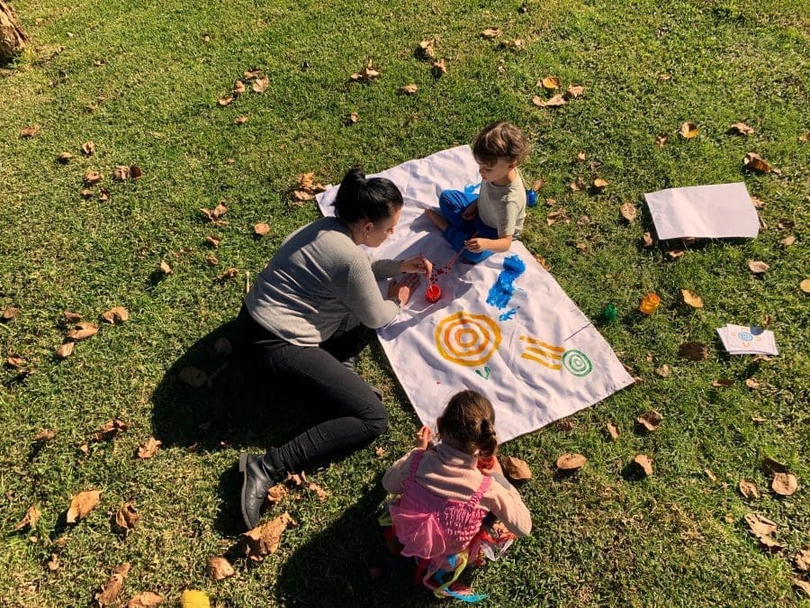 Maximise your CCS hours with sessions outdoor picnic paint on grass