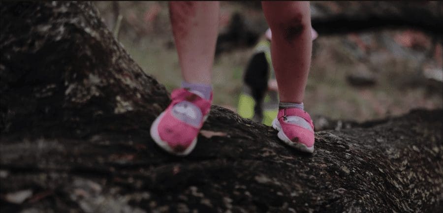 risky play feet on log