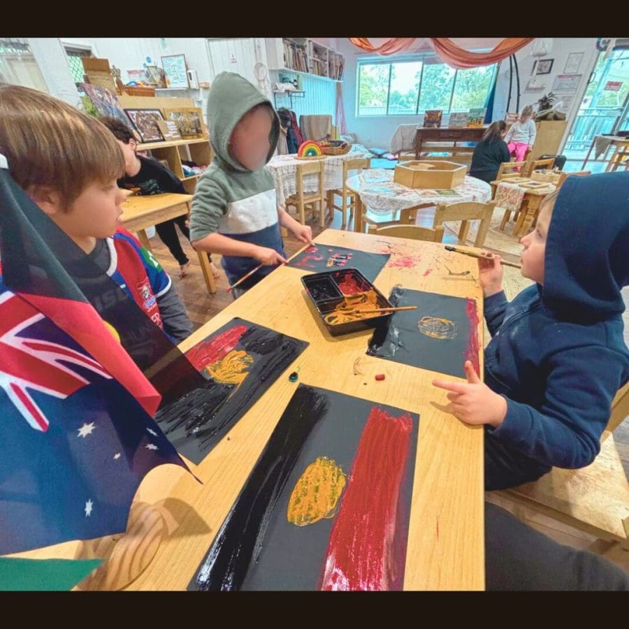 Painting the Australian, Aboriginal and Torres Strait Islander flags of Australia during NAIDOC week